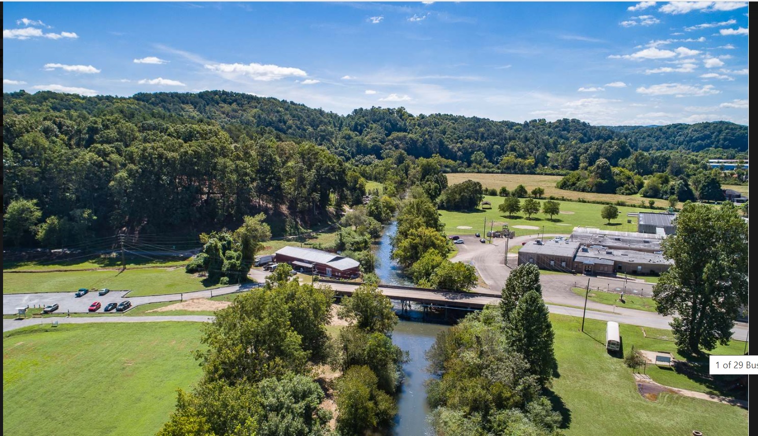 Aerial view of Ellijay RiverSpace, the river, and the surrounding North Georgia landscape